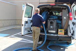 Disaster Restoration Van And Technician At Commerical Job Location